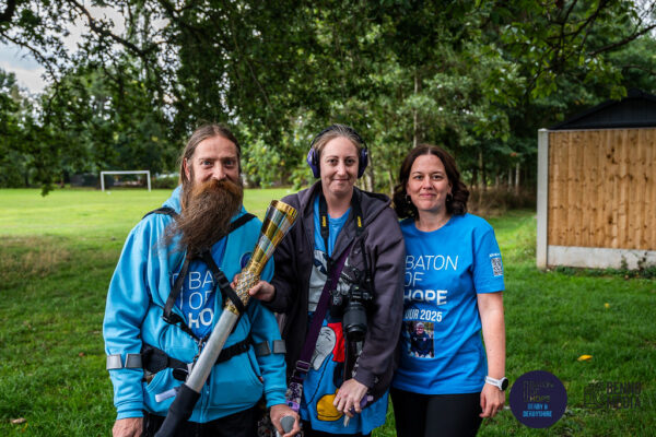 Tim baton-bearing the Baton of Hope 2025
